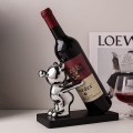 Stojak na wino butelkę dekoracyjny z figurką srebrną