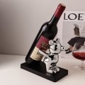 Stojak na wino butelkę dekoracyjny z figurką srebrną