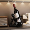 Stojak na wino butelkę dekoracyjny z figurką czarną